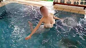 Stunning brunette works out solo in pool with sexy moves!