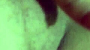 alone at home, she indulges in some private masturbation with her shaved pussy