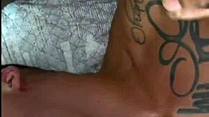 Two well-endowed men fucking the pretty twink in a fetish session