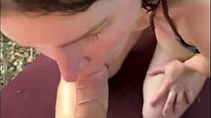 Horny teen in bikini gives oily titjob and blowjob on beach