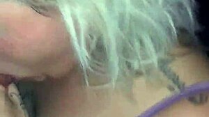 Mature blonde engages in deepthroat with big black cock