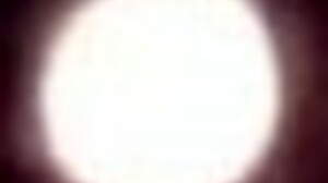 Village girl relaxes in a cold barn