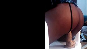 Ebony babysitter in miniskirt rides dildo, moaning loudly