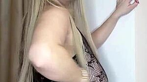 Milf with big natural tits in transparent clothes caresses herself