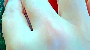 Latina teen fingers her shaved wet pussy with dildo