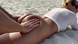 blonde milf acts as the hottest slut on the beach.