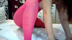 Big ass teen shoves dildo in both holes.