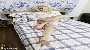 Pretty blonde in pink shows off big natural tits while squirting solo in masturbation