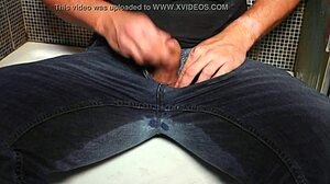 Guy pees in wet jeans and cums publicly