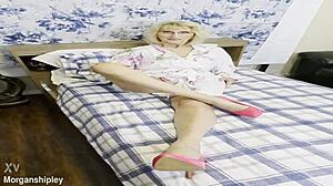 Pretty blonde in pink shows off big natural tits while squirting solo in masturbation