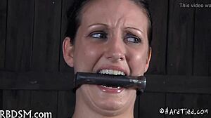 Caged Babe Gives Fellatio.