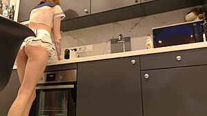 Hot tight pussy tall latvian sexy redhead lilly in a transparent miniskirt and see through top shows her beautiful ass and tits in the kitchen