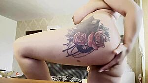 Blonde tattooed girl casually fingering her ass and pussy at home