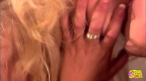 Blonde lesbian lover stuffs skinny girl's tight cunt with long dildo until she cums.