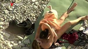 beach voyeur watches brunette riding cock doggystyle