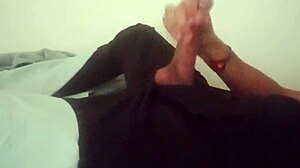 horny guy moans while jerking his huge cock in bedroom after work, cumming hard