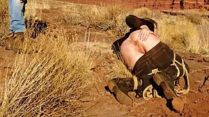 Rebel Rhyder's asshole gets whipped before rough anal in dirt and piss outdoors in western USA.