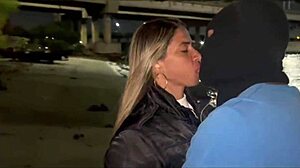 my wife giving it to another on the beach sand