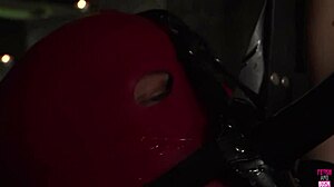 brunette uses strapon on guy with bdsm mask for cumshot