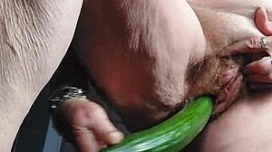 German oma fucks her old hairy beaver with cucumber