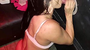 Brunette sucks cock in glory hole