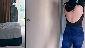 Pretty Asian Ladyboy strips jeans, showing gifted big boobs