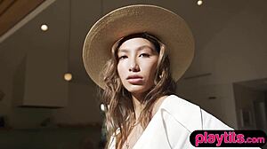 Petite Latina strips to reveal big tits