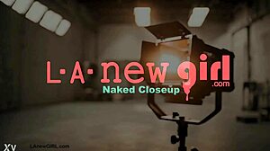 striking dark-haired stunner shows off her sexy body on the sofa