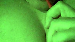 Sucking lollipop while playing with wet tits