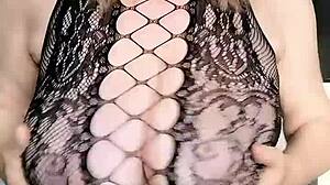 Look at this MILF in black net dress with huge tits and pussy close-up!