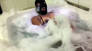 The brunette feels sensual in the bathtub, showing her big pussy.