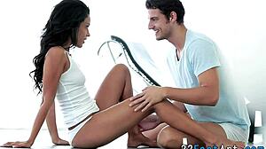 babe feels intense pleasure from footjob and fingering, leading to cumshot on her feet