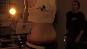 at the party, the teen girl gets her pussy toyed by another while everyone watches