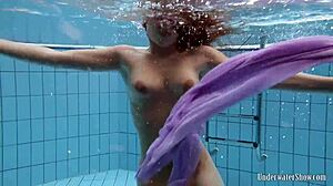 Aneta Shows Big Tits In Purple Dress Underwater In Pool