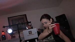at the party, the teen girl gets her pussy toyed by another while everyone watches